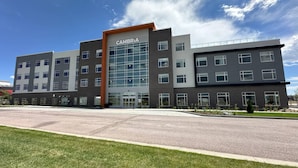A multi-story building with a prominent entrance labeled 'CAMBRIA'. - Cambria Hotel Colorado Springs - Air Force Academy (Colorado Springs)