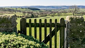 A rural landscape with a stone wall and a wooden gate. - 2 Bed in Harrogate (oc-hh018) (Lindley)