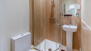 A bathroom with a glass-enclosed shower, a white sink, and a mirror above the sink. - 1 Bed in York (oc-g0032) (Crayke)