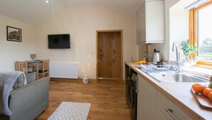 A compact kitchen with a dishwasher, a sink, and a window. - 1 Bed in Darlington (oc-75147) (Stapleton)