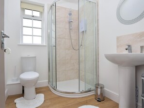 A modern bathroom with a glass-enclosed shower, a toilet, a sink, and a window. - 2 Bed in Middlesbrough (oc-75544) (Stokesley)