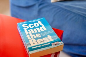 A book titled 'Scotland the Best' by Peter Irvine on a red surface. - 1 Bed in Blairgowrie (oc-ca361) (Blacklunans)