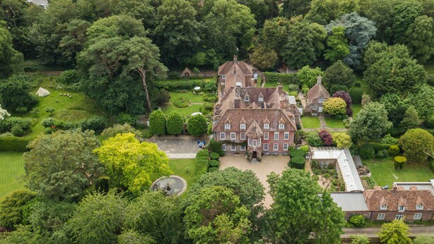 A large, historic building with multiple wings, surrounded by lush gardens and trees. - The Manor, Deal, Kent (Deal)