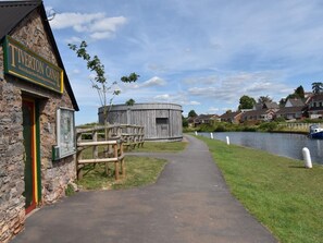A stone building with a sign reading 'Tiverton Canal.' - 2 Bed in Crediton (oc-78468) (Cheriton Fitzpaine)