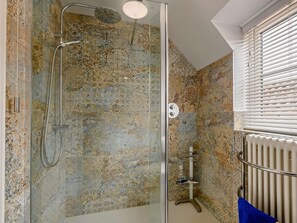A shower with a glass door, a hand showerhead, and a wall-mounted towel rack. - 2 Bed in Holt (oc-72898) (Holt)