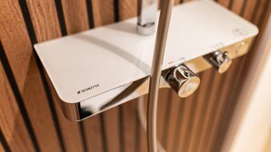 A white electronic device with the brand 'SCHUTTE' mounted on a wall, connected to a metal pipe. - Furnished Apartment Radebeul with Shared Terrace, Garden & Wi-Fi (Radebeul)