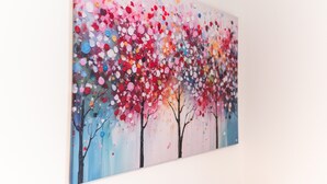 A wall-mounted painting of trees with colorful leaves. - Furnished Apartment Radebeul with Shared Terrace, Garden & Wi-Fi (Radebeul)