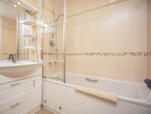 A bathroom with a glass-enclosed shower, a white bathtub, and a sink with a mirror. - 2 Bed in Bridport (oc-dc162) (Chideock)