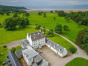 A large estate with a central building surrounded by expansive green lawns and trees. - 2 Bed in Applecross (oc-ca422) (Applecross)