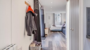 A bedroom with a bed, a nightstand, a window, and a wardrobe. - 1 Bed in Norwich (oc-76493) (East Harling)