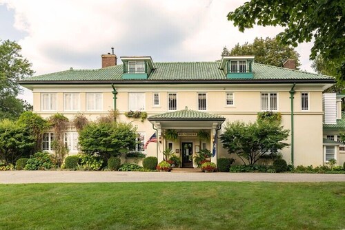 Tucked away and bright, this room is located on the second floor of the Belvedere Estate with a queen bed, private bath, and beautiful garden views