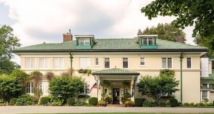 Tucked away and bright, this room is located on the second floor of the Belvedere Estate with a queen bed, private bath, and beautiful garden views