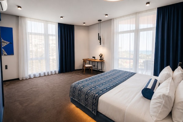 Deluxe Triple Room, Sea View | Premium bedding, minibar, in-room safe, desk