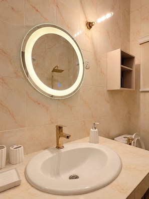 Bidet, towels, soap, toilet paper