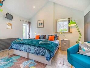 A bedroom with a bed, a desk, a chair, a TV, and a window. - 3 Bed in Nr Masham (oc-g0149) (Healey)