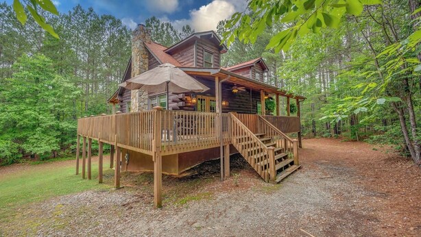 A cabin with a deck, stairs, and a covered outdoor area. - Private LogHome/ HotTub/Lake Lure/pet (Lake Lure)