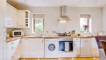 Oven, dishwasher, high chair, cookware/dishes/utensils