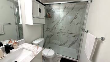 Hair dryer, towels, soap, toilet paper