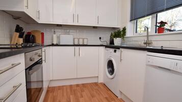 Oven, dishwasher, high chair, cookware/dishes/utensils