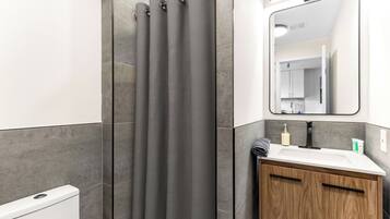 Shower, hair dryer, towels, soap