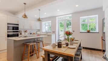 Oven, dishwasher, high chair, cookware/dishes/utensils
