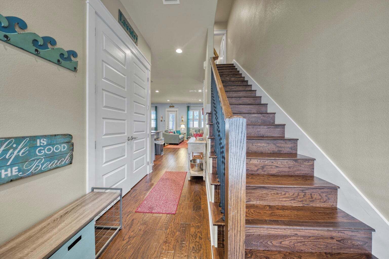 A staircase with wooden steps leading to a second floor.