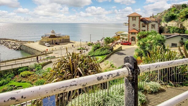 A coastal town with a lighthouse, a historic building, and a promenade overlooking the sea. - 3 Bed in Ventnor (oc-80547) (Ventnor)