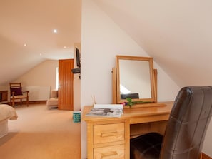 A bedroom with a wooden desk, a mirror, a bed, a chair, and a radiator. - 3 Bed in Chopgate (oc-g0110) (Chop Gate)