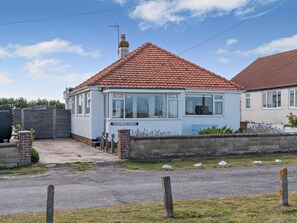 A single-story house with a red-tiled roof, a front porch, and a visible chimney. - 2 Bed in Flamborough (oc-g0115) (Flamborough)