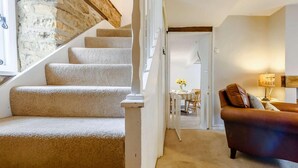A staircase with carpeted steps leading to a dining area. - 2 Bed in Cheltenham (oc-46677) (Bourton-on-the-Water)