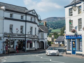 A traditional furniture store on High Street with a white facade and black trim. - 1 Bed in Crickhowell (oc-bn198) (Crickhowell)