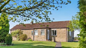 A stone house with a tiled roof, a front door, and a small garden. - 2 Bed in Toft Hill (oc-80005) (High Etherley)