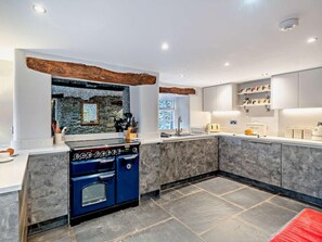 A modern kitchen with a built-in stove, marble countertops, and a stone backsplash. - 5 Bed in Cartmel (oc-80332) (Cartmel)