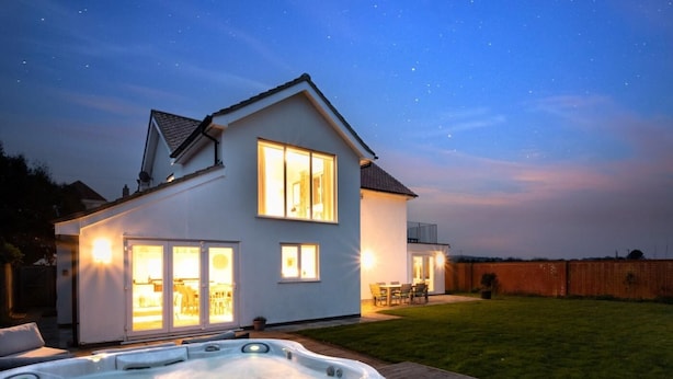 A two-story house with a hot tub in the backyard. - 4 Bed in Cromer (oc-81469) (West Runton)