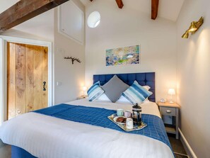 A bedroom with a bed, bedside tables, a coffee maker, and a tray with breakfast items. - 1 Bed in Challacombe (oc-81477) (Challacombe)