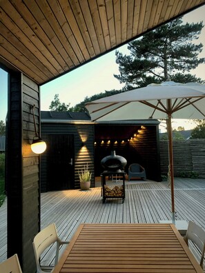 Outdoor dining - New timber house with cozy terrace near the beach (Hals)