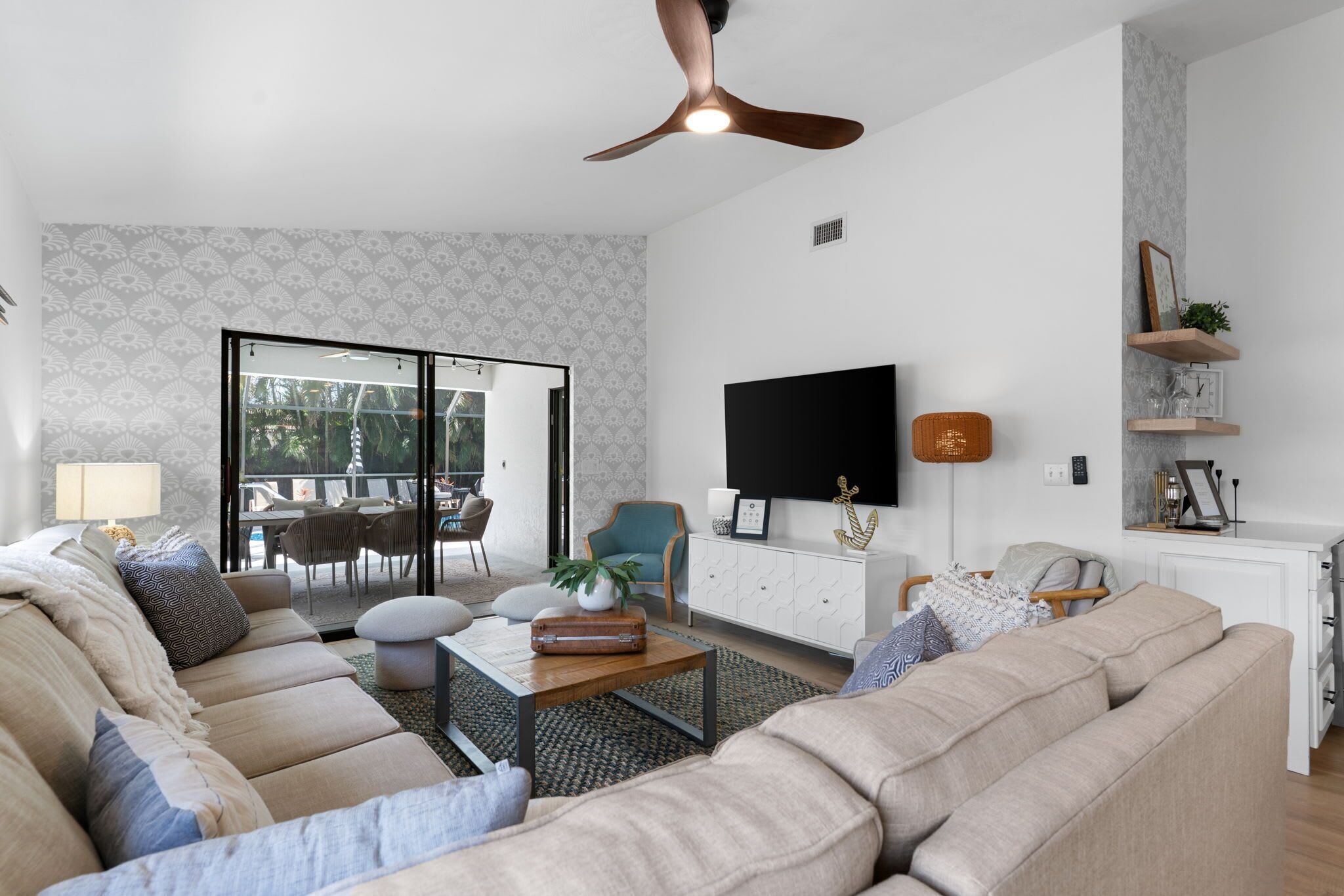 A modern living room with a sofa, coffee table, and TV.