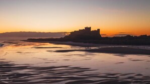 A castle on a beach at sunset. - 4 Bed in Belford (oc-83373) (Belford)
