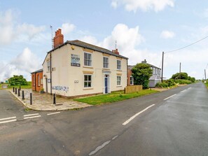 A two-story building with a sign for 'Yorkshire Spurn Discovery Centre.' - 2 Bed in Hull (oc-83428) (Kilnsea)