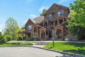 A two-story house with a porch, a staircase, and a 'No Parking' sign. - Large condo near Mountain Creek & Crystal Springs (Vernon Township)