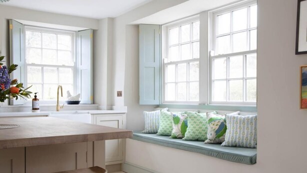 A kitchen with a window seat, a sink, and a bar stool. - 4 Bed in Penrith (oc-sz264) (Askham)