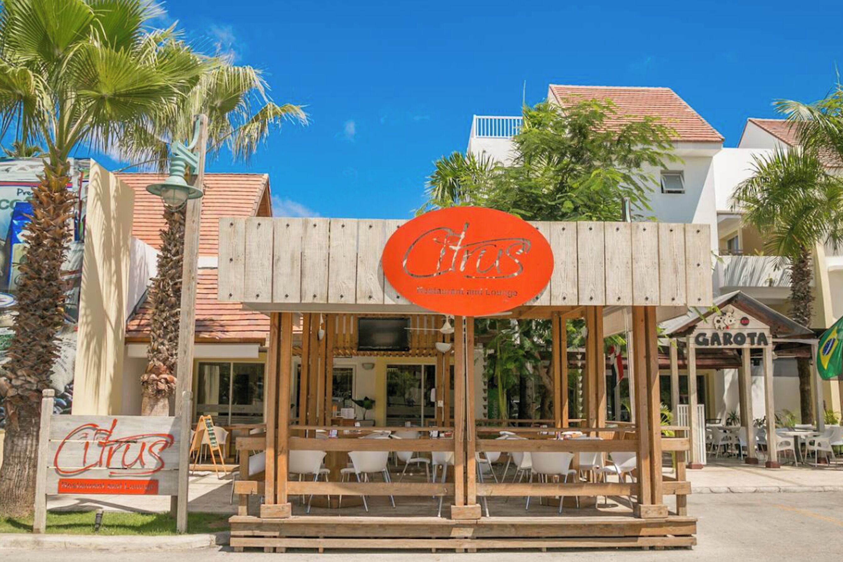 A restaurant with a wooden exterior and a sign that reads 'Citrus.'