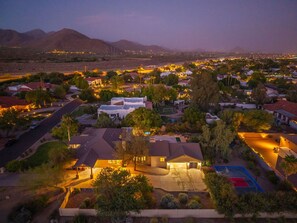 A residential area with houses, a basketball court, and a mountainous backdrop. - Scottsdale-Heated Pool-Spa-Pool Table-PickleBall (Scottsdale)