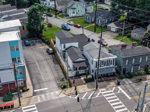 An aerial view of a residential area with houses, a street, and a crosswalk. - The Clifton | Bars, Bourbon, and Brunch on Foot | Sleeps 15 (Louisville)