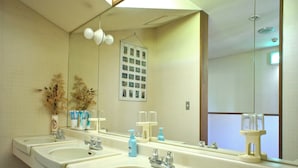 A bathroom with three sinks, a mirror, and a wall-mounted photo display. - Pension Mogu (Shinano)