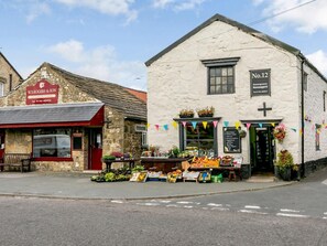 A street view with a butcher shop and a newsagent. - 1 Bed in Ripon (oc-85511) (Masham)