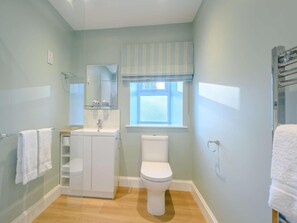 A bathroom with a toilet, sink, and glass shower enclosure. - 1 Bed in Lockerbie (oc-86068) (Lockerbie)