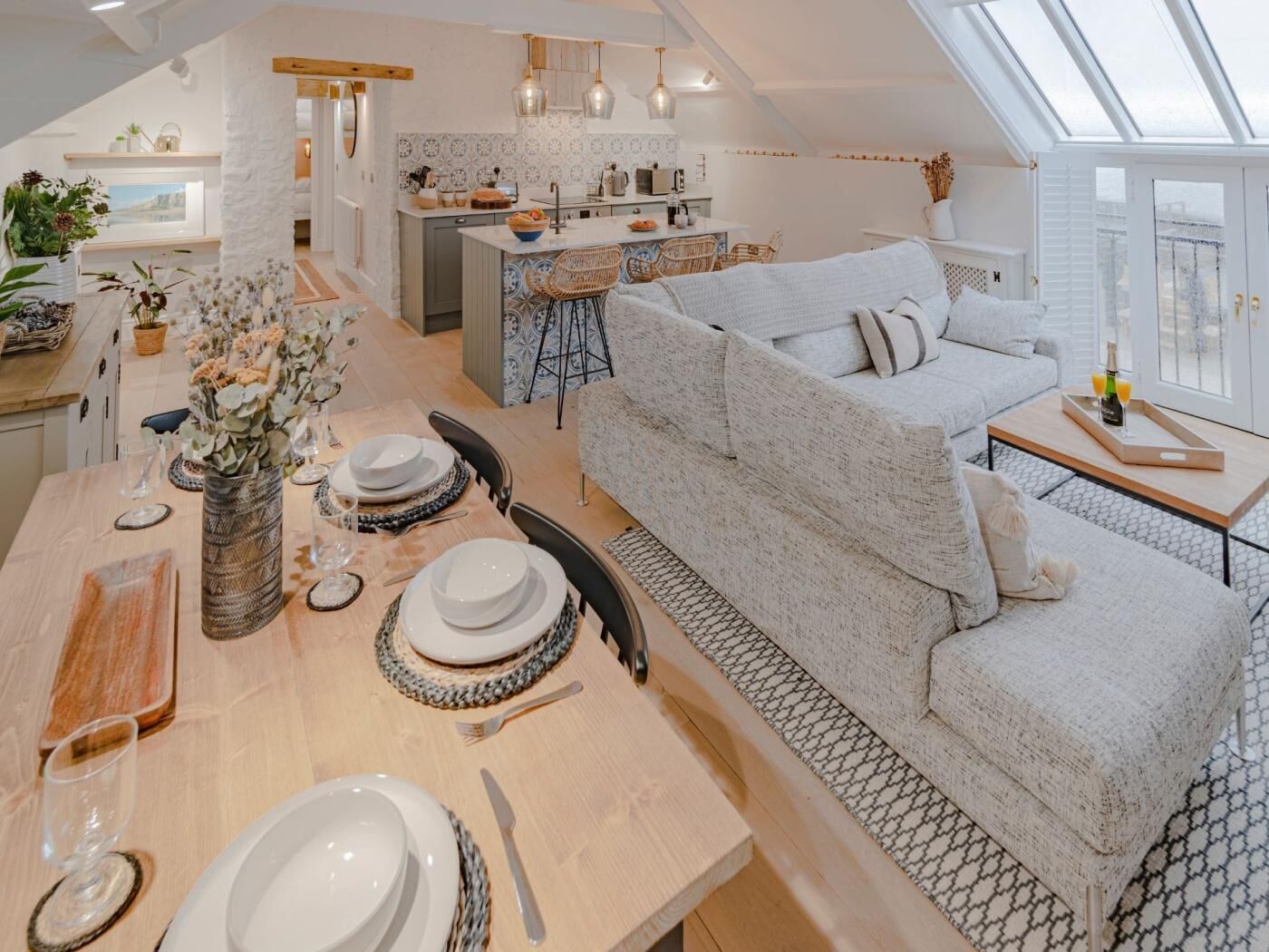 A spacious loft with a dining area, kitchen, and living space.