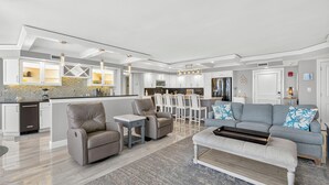 A modern living room with a sofa, armchairs, and a coffee table. - 22nd-Floor Oceanfront Luxury · Maisons Sur-Mer (Myrtle Beach)