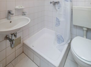 A bathroom with a sink, shower, and toilet. - Comfort Studio Apartment with Balcony (Malinska)